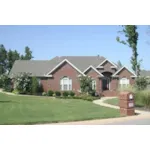 All Brick Traditional Home With Dramatic Arches