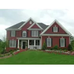 Stylish Two-Story Brick Traditional House With Front Loading Garage