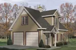 Charming two-car garage with interior space, large dormer and covered porch