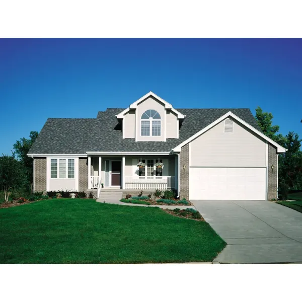 Traditional Two-Story Home Has Covered Front Porch And Large Dormer With Arched Window