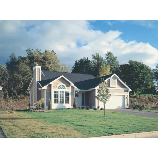 Welcoming Arched Front Window demands Attention To This Ranch