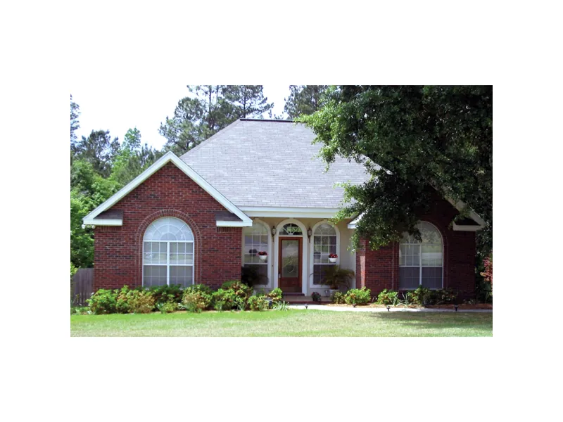Stylish Arched Windows Cover The Front Of This Ranch Home