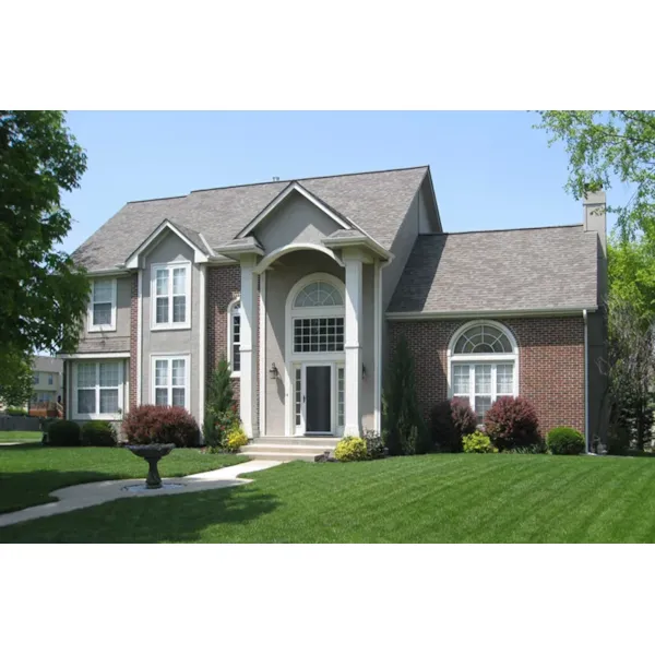 Two-Story Traditional Home Has Impressive Pillared Front Entry