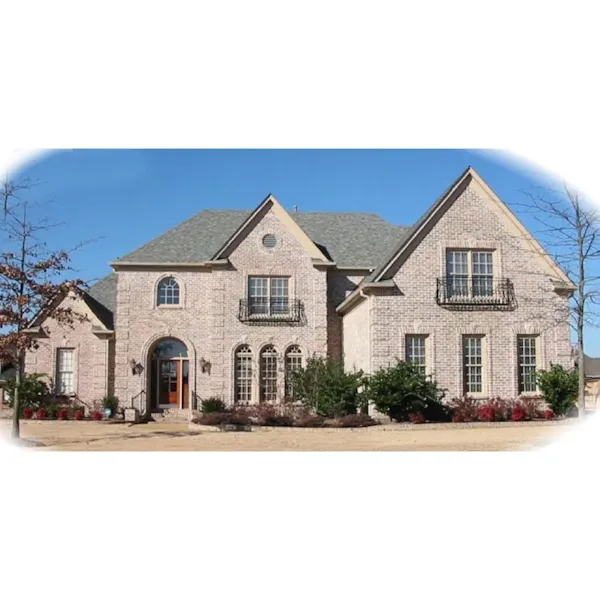 Luxury European Style Two-Story Is Covered In Brick With Wrought-Iron Second Floor Balconies