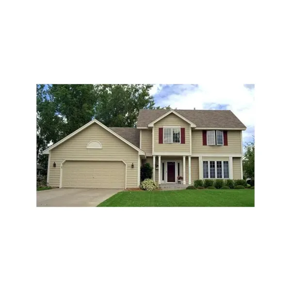 Two-Story Traditional Home Has Centered Front Entrance With Columns