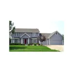 Twin Bay Windows Flank The Entrance Of This Colonial Inspired Home