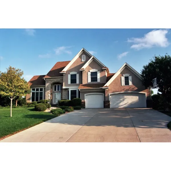 Unique Entry Accentuates This Traditional Homes Exterior