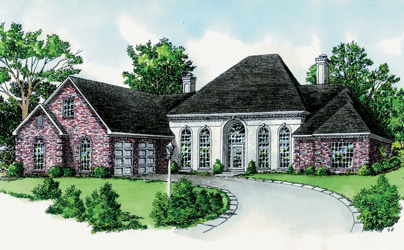 The Center Portion Of This Home Is Stucco With Arched Windows And Entry