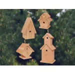 Four wooden birdhouses in multiple shapes and sizes that all look great together