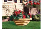 Landscape timber bowl planter makes a strong statement and has plenty of space for flowers