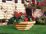 Landscape timber bowl planter makes a strong statement and has plenty of space for flowers