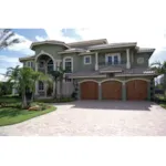 Multi-Level Spanish Stucco Home With Tile Roof