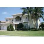 Two-Story Stucco House With Covered Porch And Second Floor Terrace