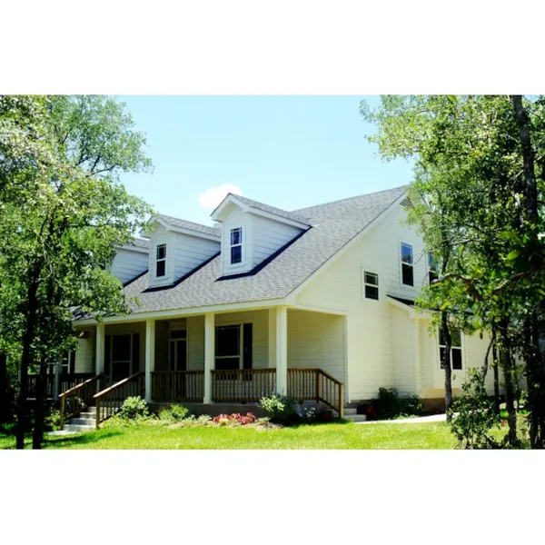 Relaxing Front Porch Invites Guests Inside