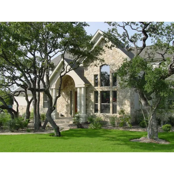 Large Brick Gabled Wall Has Palladian Window on Front Exterior Of This House