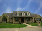 Traditional Country Style One Story With Triple Dormers And Covered Porch