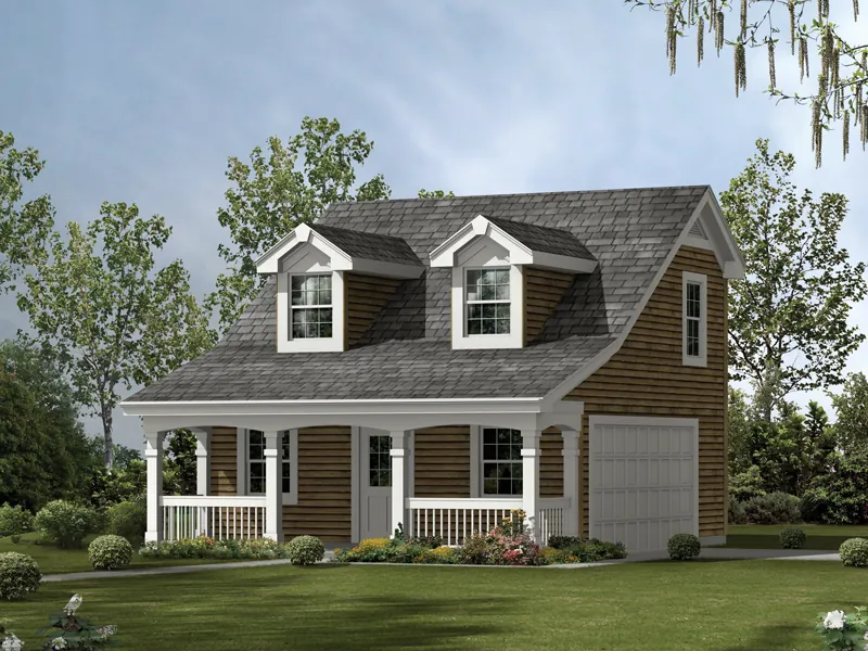 This two-car garage has the look of a cozy cabin with roof dormers and a covered front porch