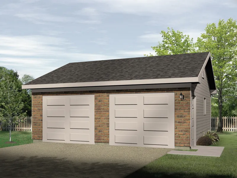 Two-car garage has two separate garage doors and brick exterior