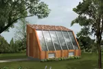 Sun-filled greenhouse has a sloped wall of atrium window perfect for growing vegetables and flowers