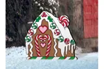 Cute gingerbread house design looks great with the gingerbread man and woman